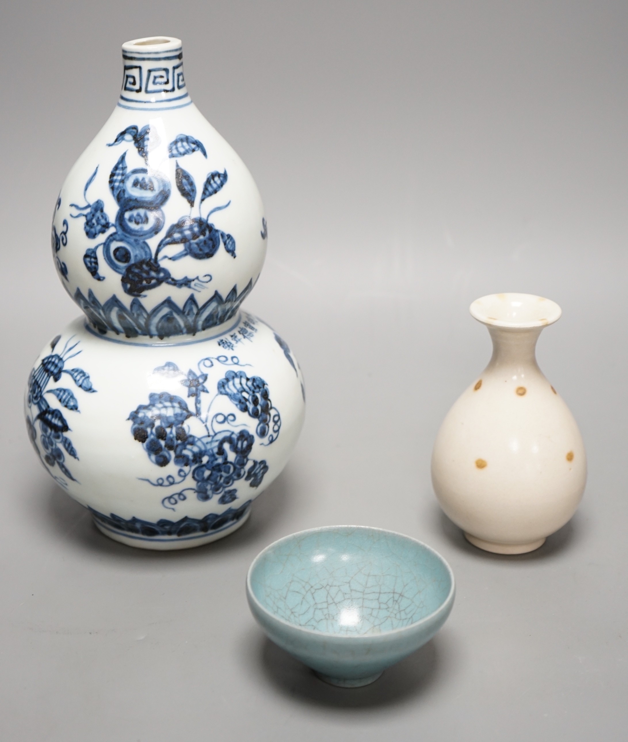 A Chinese blue and white double gourd vase, a Jun-type cup and a small baluster vase
